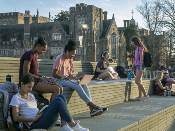 students writing on west campus